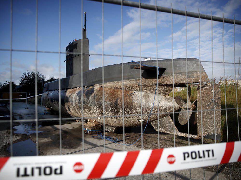 Madsen's UC3 Nautilus submarine sits on a pier behind police tape in Denmark's Copenhagen harbor in 2017 as authorities investigated the disappearance of Swedish journalist Kim Wall. Madsen later was sentenced to life in prison for Wall's murder.