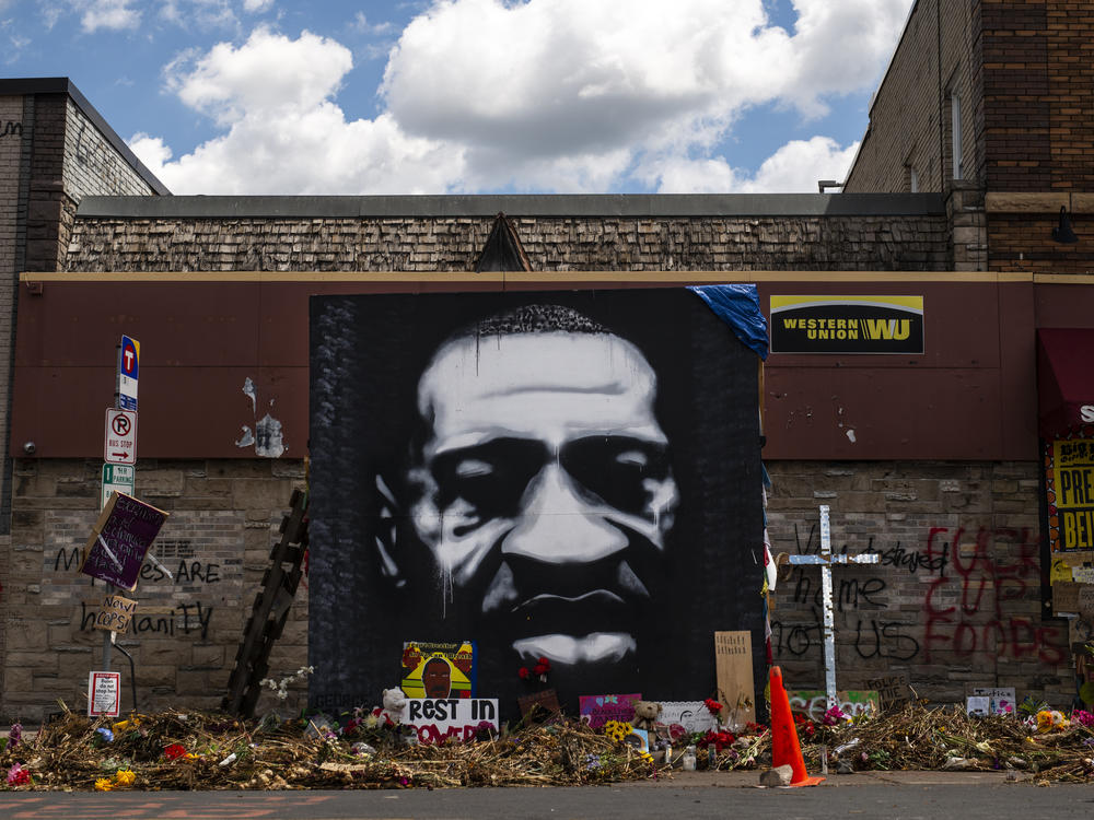 A mural honors George Floyd at the intersection of 38th St. and Chicago Ave., where he was killed by Minneapolis police on May 25, inspiring protests and police reform efforts.