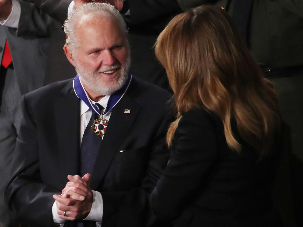 Rush Limbaugh says he intends to keep putting on his radio show despite his stage 4 lung cancer that he says has recently progressed. Here, he's seen reacting as first lady Melania Trump gives him the Presidential Medal of Freedom during the State of the Union address in February.
