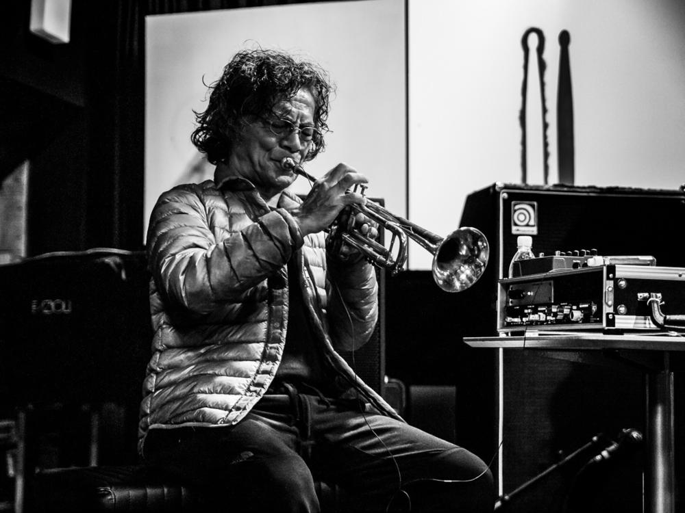 Esteemed jazz musician Toshinori Kondo playing the trumpet.