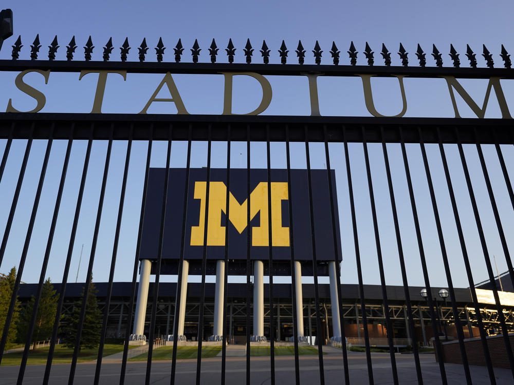 The University of Michigan football stadium is shown in Ann Arbor, Mich., this summer. Health officials in Michigan say infections among university students account for over 60% of local infections.