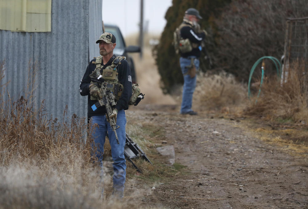 Members of the Real 3%ers Idaho stand watch during a convoy protection drill in western Idaho in January.