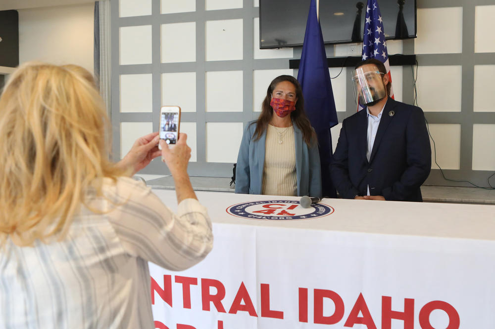 Parker and Idaho State Sen. Michelle Stennett pose for a photo before their debate in Hailey, Idaho, on Sept. 17. Parker is running as a Republican against the longtime Democratic incumbent.