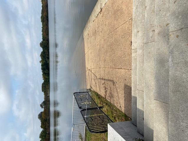 A walkway at the Tidal Basin is covered with water.