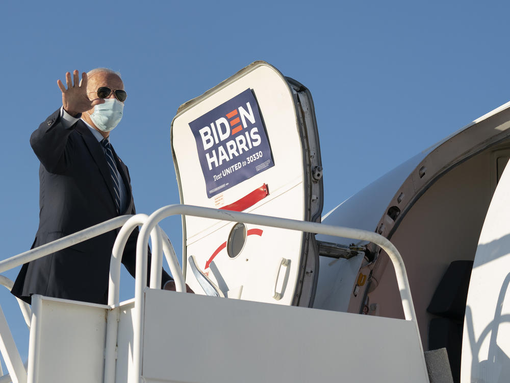 Democratic presidential nominee Joe Biden boards his campaign plane.