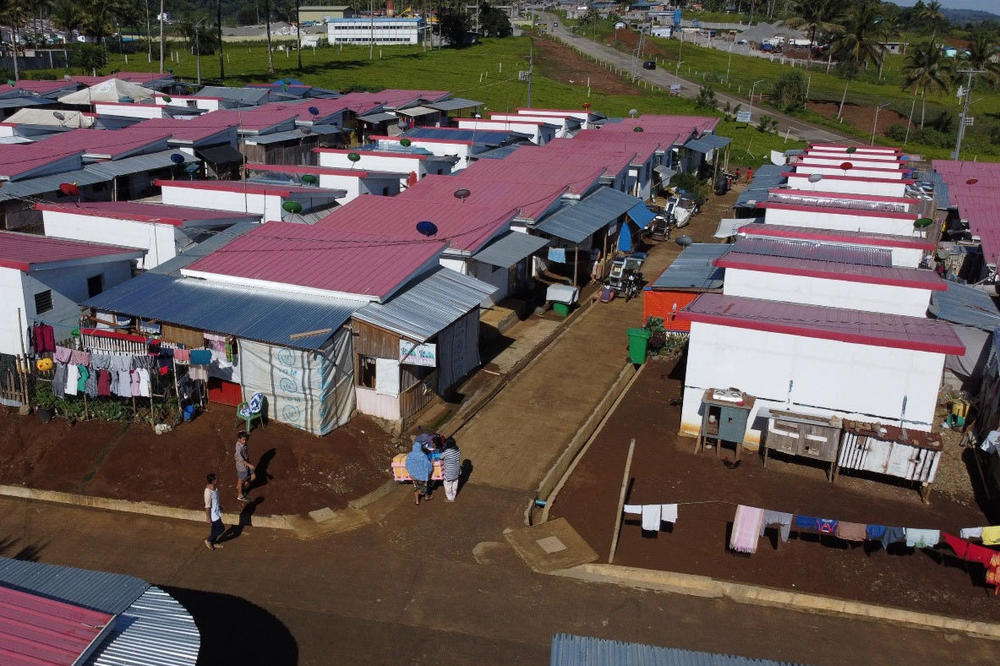 Pacasum donated land to the government, which built 109 structures with red tin roofs to house displaced people.