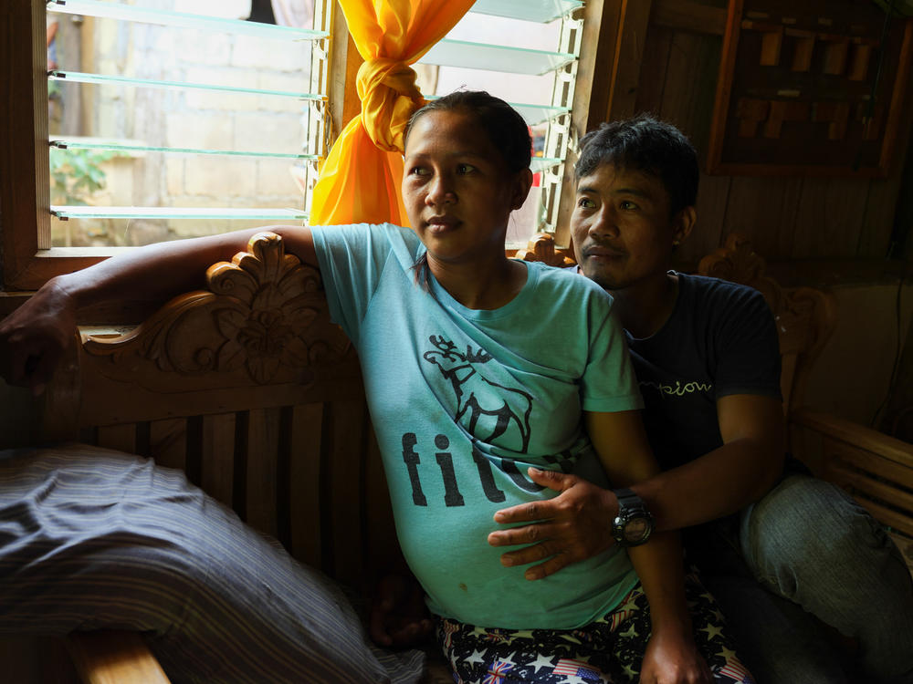 Risa Calibuso and her husband, Michael Calibuso, at home in Abinganan.
