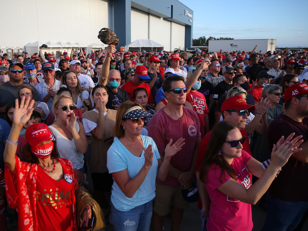 Supporters cheer during a Trump rally in Pensacola, Fla. Rallies and in-person events have been a key part of the campaign strategy, even in the midst of the pandemic.