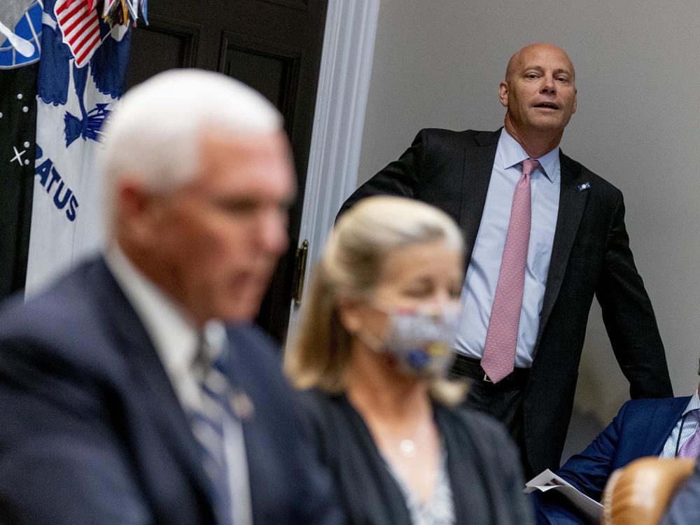 Marc Short, the chief of staff to Vice President Pence, listens to Pence speak during a White House event in September. Short tested positive for the coronavirus on Saturday.