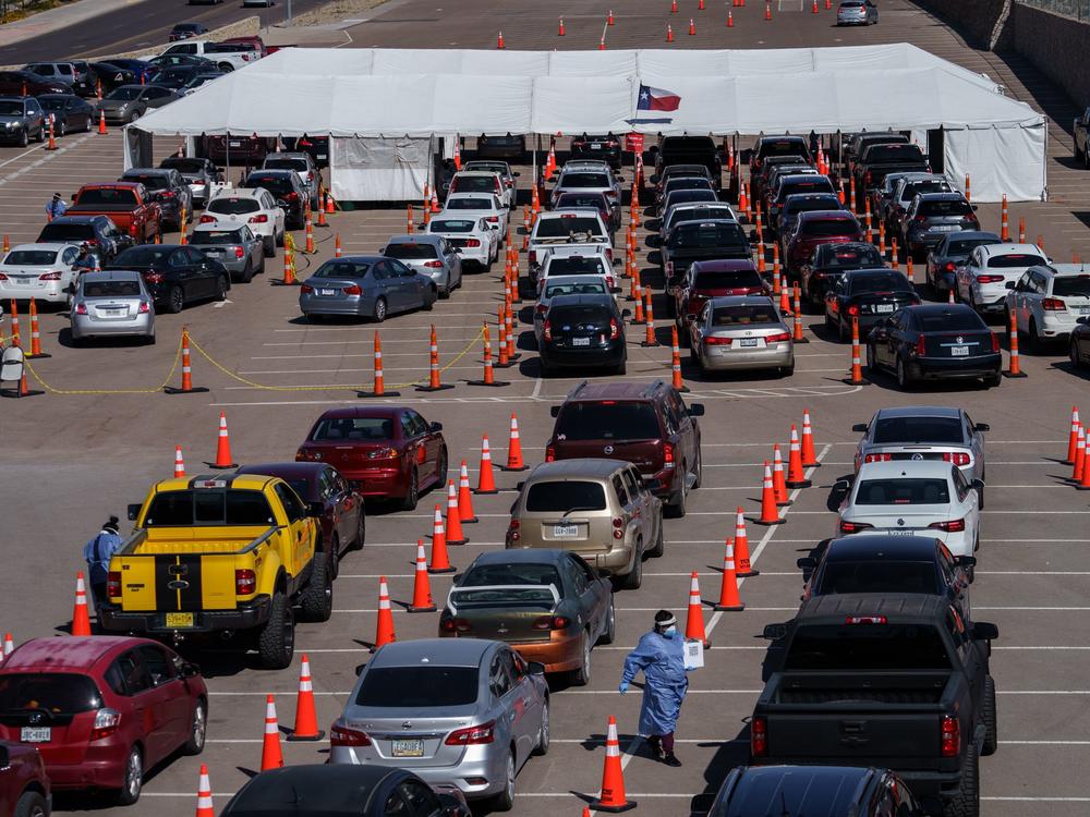 Cars line up Friday at a coronavirus testing site at the University of Texas at El Paso. The area has seen a surge in cases in recent weeks, and a two-week curfew is now in effect in El Paso County.