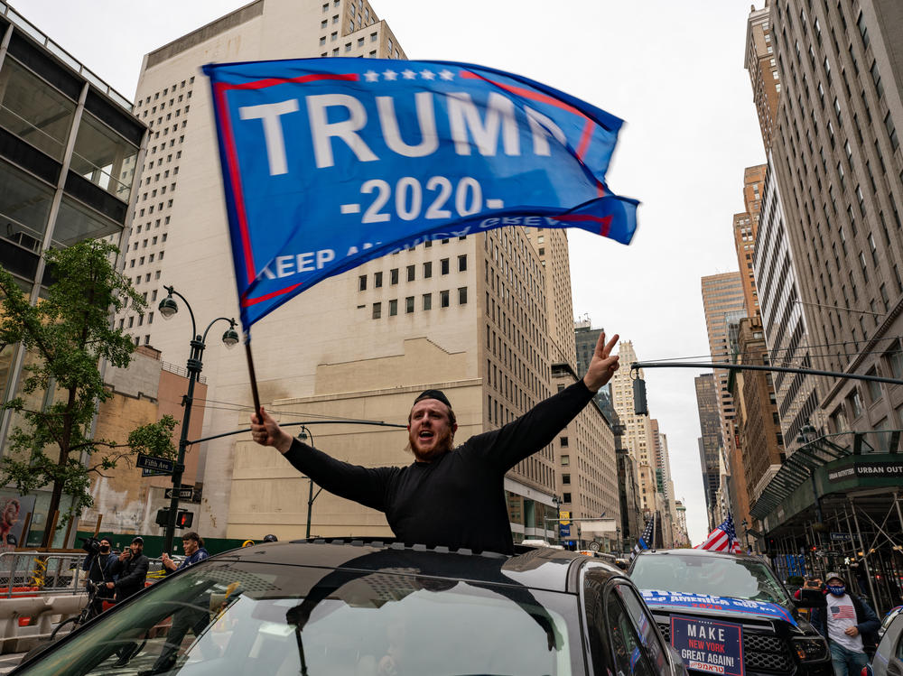 A person participates in a rally Sunday for President Trump on Fifth Avenue in New York City. Trump supporters and protesters clashed in Times Square, prompting nearly a dozen arrests.