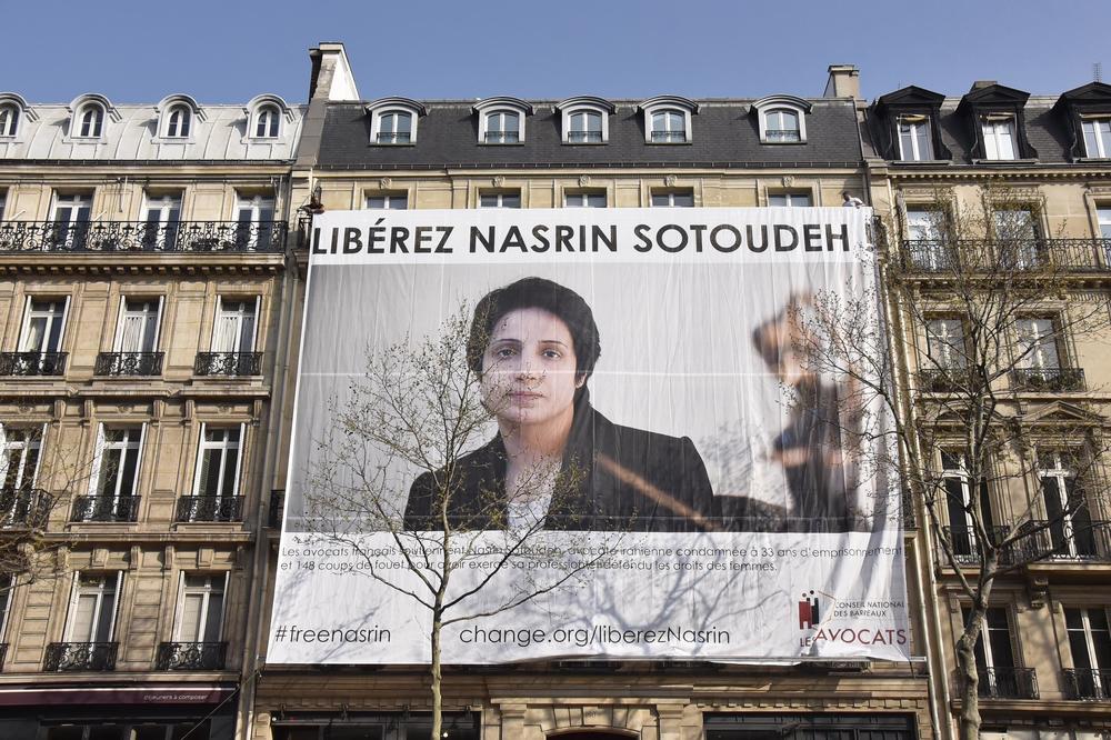 A large banner in support of Iranian human rights lawyer Nasrin Sotoudeh is displayed in Paris in 2019. Sotoudeh is serving a 38-year prison sentence in Iran. Her health has declined after a five-week hunger strike.