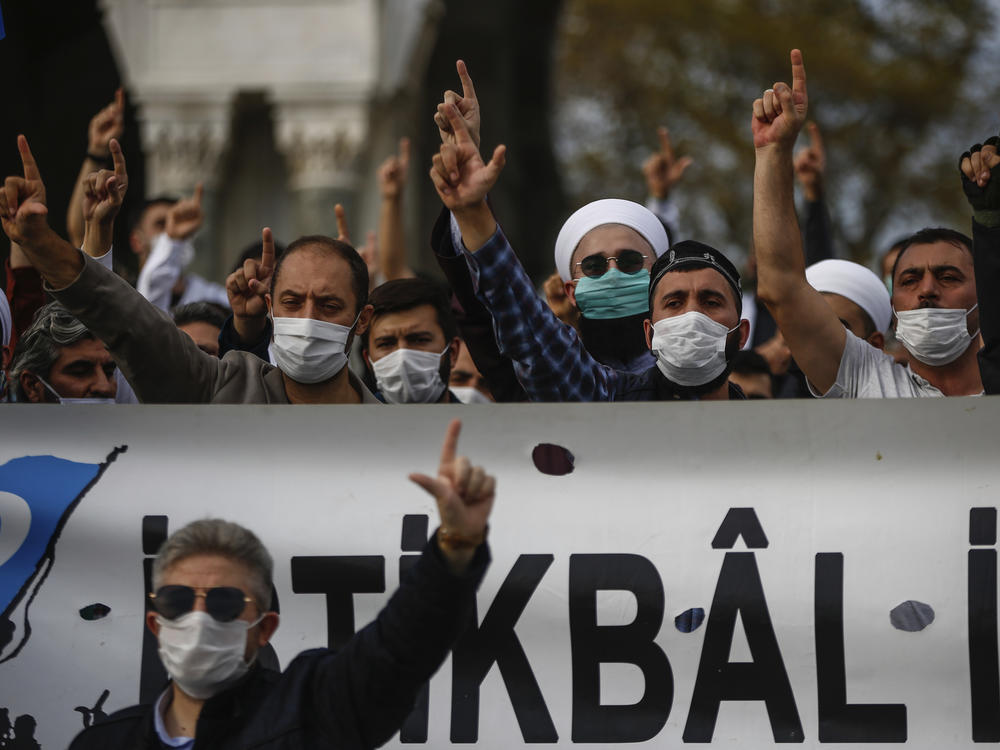 Demonstrators chant slogans during an anti-France protest in Istanbul on Sunday, as tensions rise between the two countries.