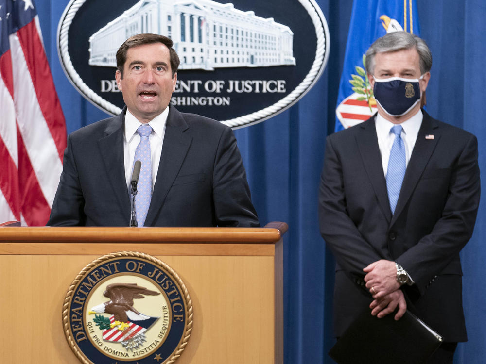 Assistant Attorney General for National Security John Demers speaks during a virtual news conference at the Department of Justice, Wednesday, Oct. 28, 2020 with FBI Director Christopher Wray.