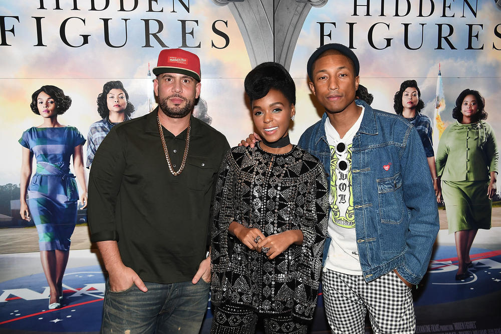 DJ Drama with Janelle Monae and Pharrell Williams in 2016.