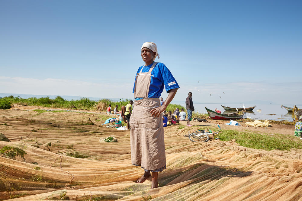 Milka Onyango stands on the fishing nets strewn across Nduru Beach in November 2019.
