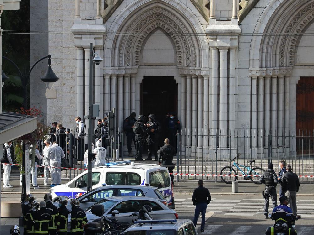Members of a French elite tactical police unit search the Notre Dame Basilica in Nice after a knife attack that killed three people and injured several others on Thursday.