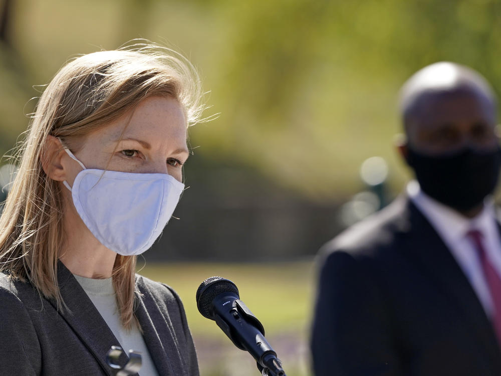 Nicole Galloway, Missouri's state auditor and Democratic candidate for governor, is challenging Republican Gov. Mike Parson, primarily on his coronavirus record. Here, Galloway addresses the media last month, while Kansas City, Mo., Mayor Quinton Lucas looks on during a news conference.