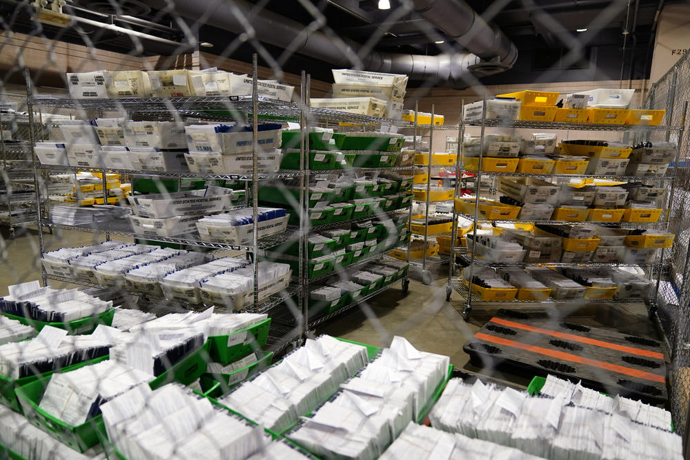 Ballots at Philadelphia's mail-in ballot sorting and counting center on Oct. 26. Under state law, counties can't open ballots to prepare them for counting until 7 a.m. on Election Day. That's one reason why Philadelphia spent $5 million on new equipment to speedily process mail-in ballots.