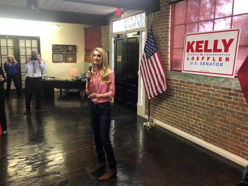 Republican Sen. Kelly Loeffler campaigns in Buford, Ga., telling supporters she's 100% with President Trump.