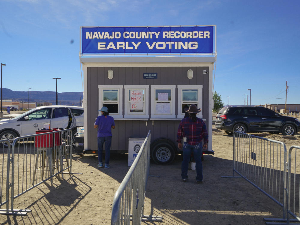 Navajo voters casting their ballots after riding 10 miles on horseback through Navajo County, Ariz.