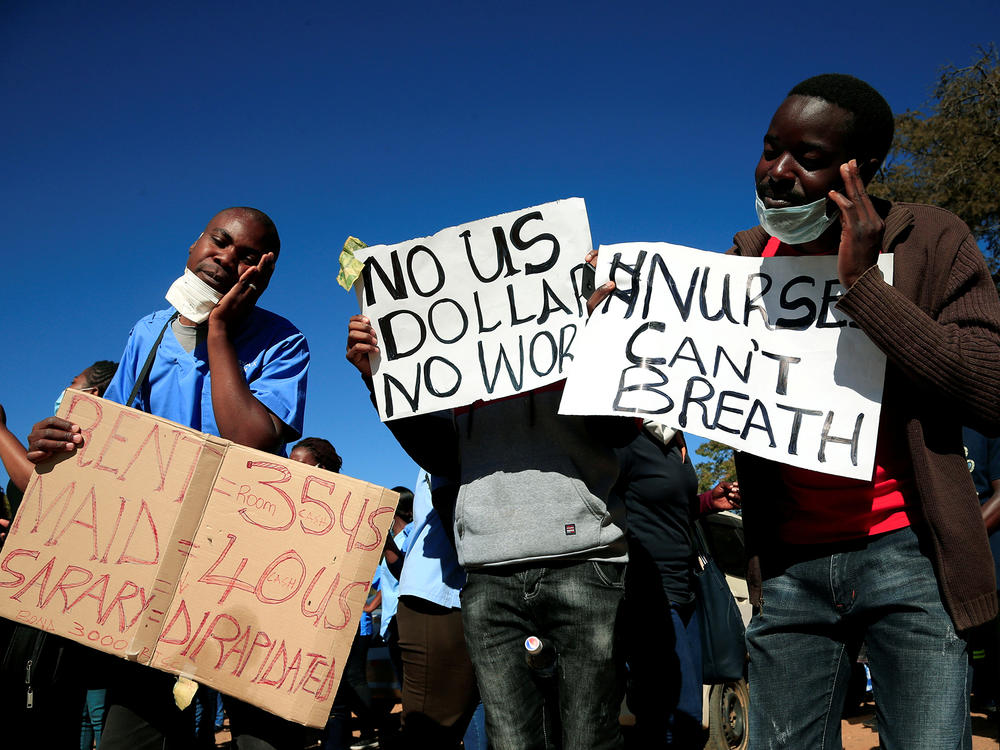Health workers protest against economic hardship and poor working conditions during the COVID-19 outbreak in Harare, Zimbabwe.