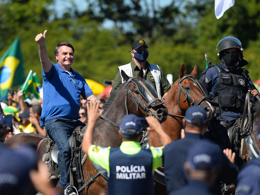 Brazilian President Jair Bolsonaro rides a horse during a May demonstration in favor of his government amid the coronavirus pandemic in front of Planalto Palace in Brasilia.