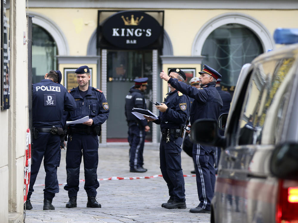 Police officers investigate the scene in Vienna on Tuesday, the day after at least one gunman went on a shooting spree in the city center before he was shot and killed by police.