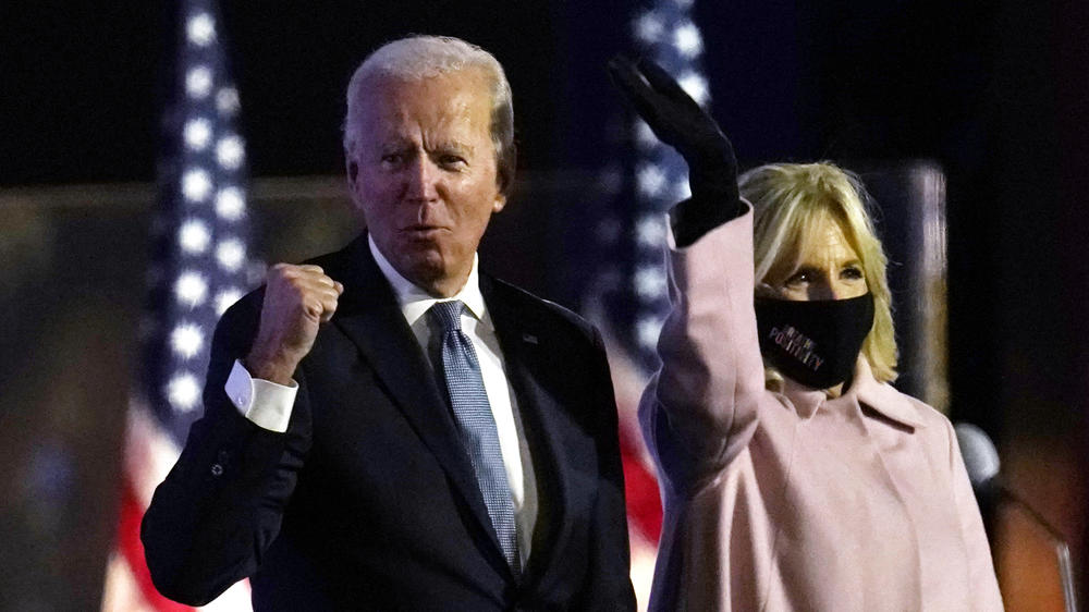 Biden speaks to supporters early Wednesday in Wilmington, Del., with his wife, Jill Biden.