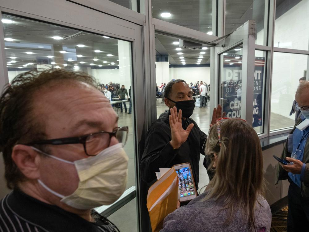 Supporters of President Trump try to enter a room where Michigan absentee ballots are being counted Wednesday at TCF Center in Detroit.