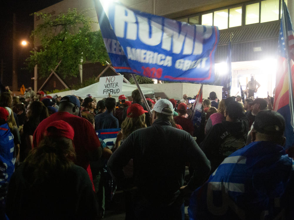 Supporters of President Trump gather to protest election results at the Maricopa County Elections Department office on Nov. 4 in Phoenix.