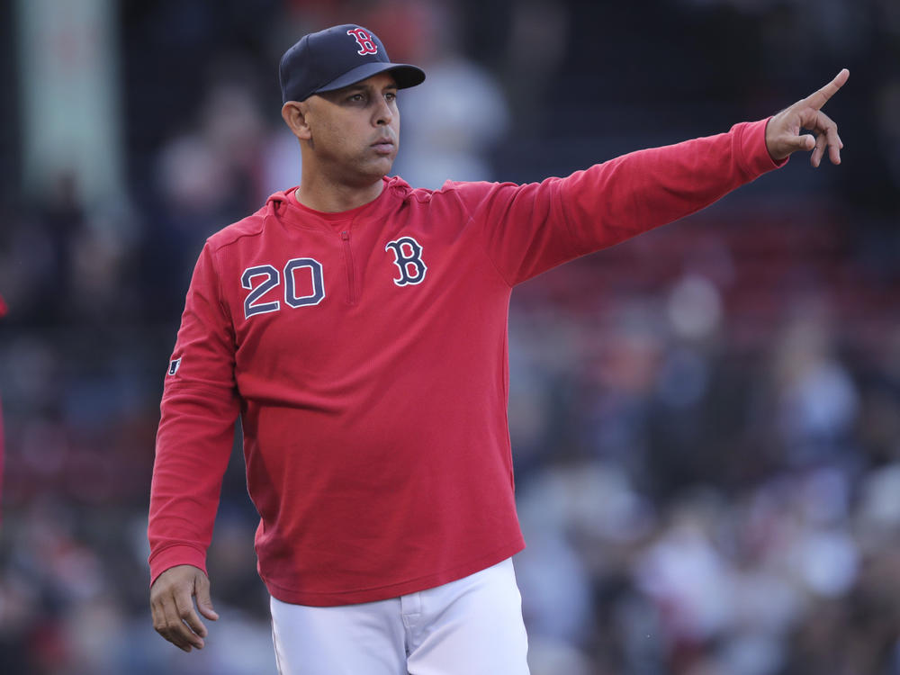 The Boston Red Sox have reportedly rehired Alex Cora as the team's manager. He is seen above as he gestures toward the outfield after a win over the San Francisco Giants in a game at Fenway Park in Boston in 2019.