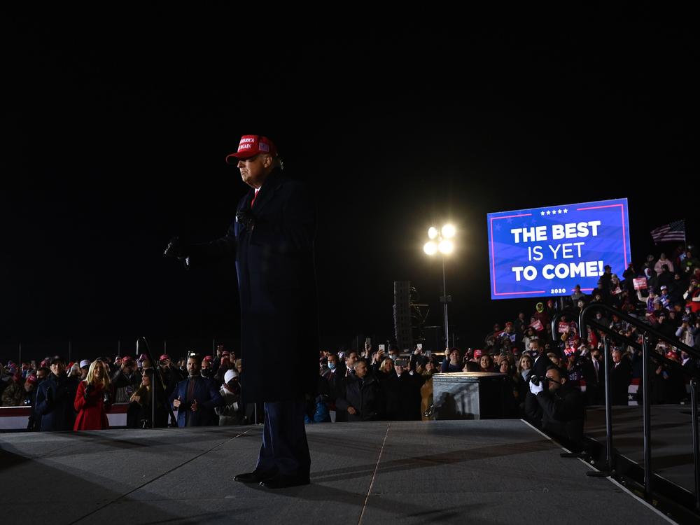 Trump takes the stage at his final rally of the 2020 campaign, after midnight in Grand Rapids, Mich., where he held the last rally of his 2016 campaign.