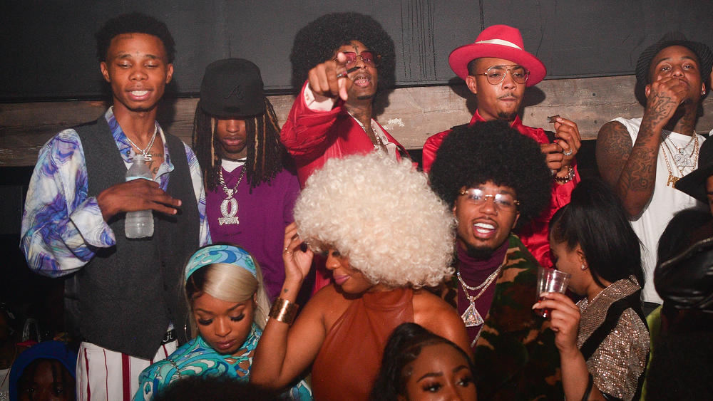 King Von (back row, second from left) pictured with 21 Savage, G Herbo and Metro Boomin, photographed at a '70s-themed birthday party for 21 Savage on Oct. 21, 2020 in Atlanta, Ga.