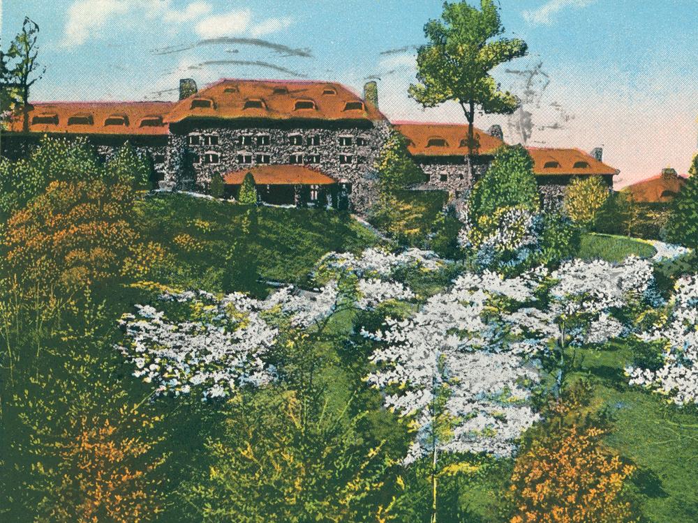 An archival postcard of the Grove Park Inn in Asheville, N.C., where much of the novel <em>Even As We Breathe</em> is set.