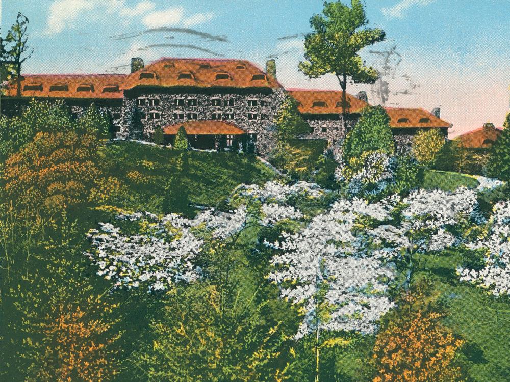 An archival postcard of the Grove Park Inn in Asheville, N.C., where much of the novel <em>Even As We Breathe</em> is set.