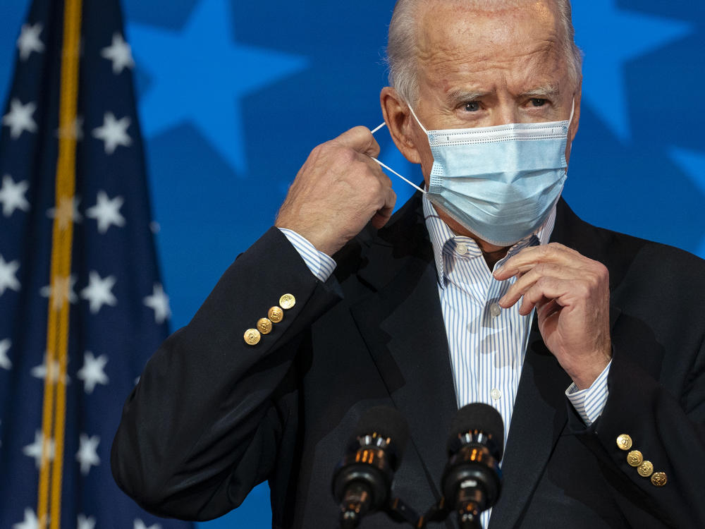Joe Biden, now the president-elect, removes his face mask Thursday to speak in Wilmington, Del. When he takes office, Biden will be dealing with a virus that is rampaging through the country.