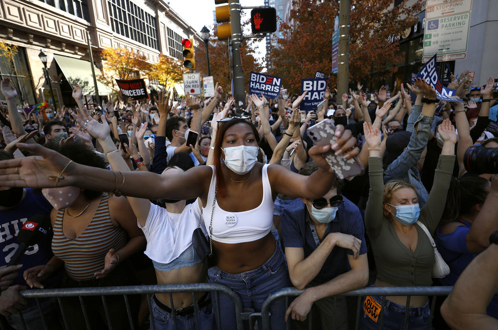 People cheer Saturday outside Philadelphia's convention center, where officials had set up a ballot-counting venue.