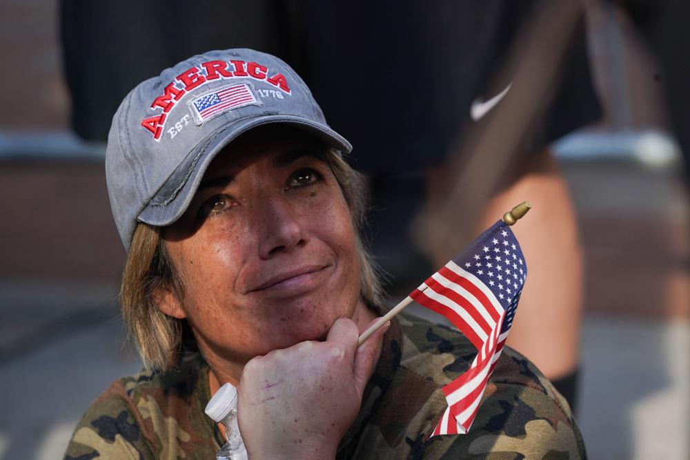 A crestfallen Trump supporter looks on outside the Pennsylvania Convention Center in Philadelphia Saturday after Joe Biden was declared winner of the 2020 presidential election.