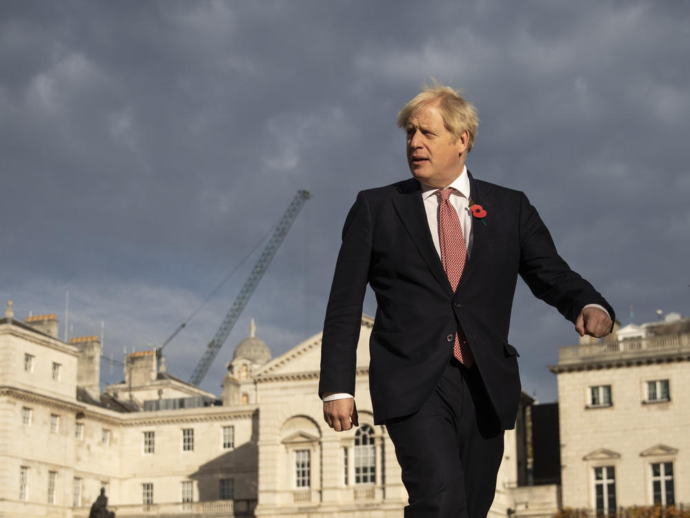 British Prime Minister Boris Johnson walks across Horse Guards Parade to Admiralty House on Friday in London.