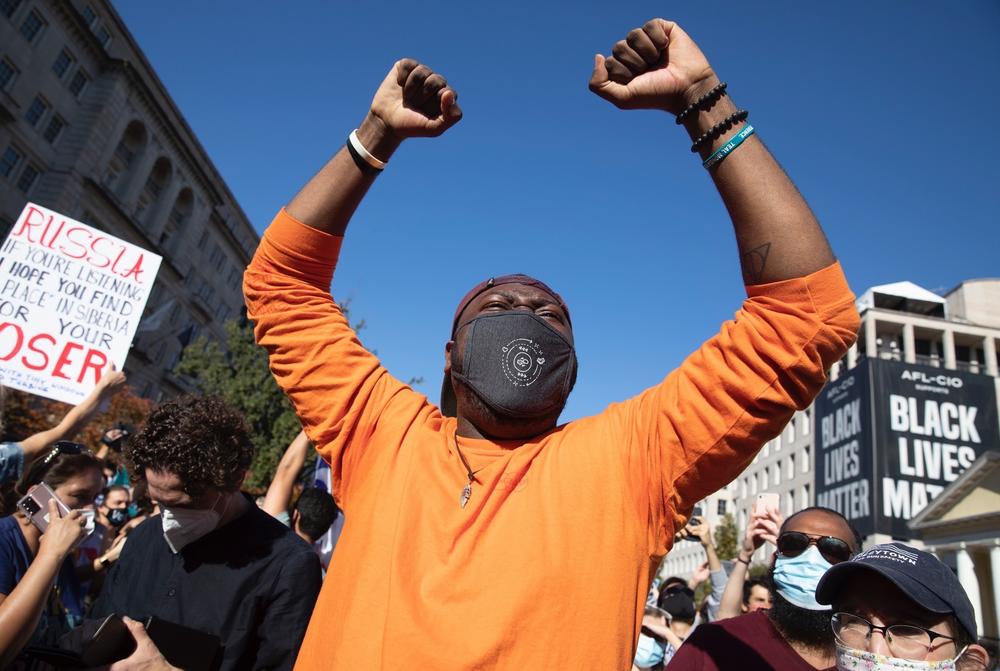 Kareem Primo of Washington, D.C. celebrates former Vice President Biden becoming president-elect and Sen. Kamala Harris becoming vice president-elect.