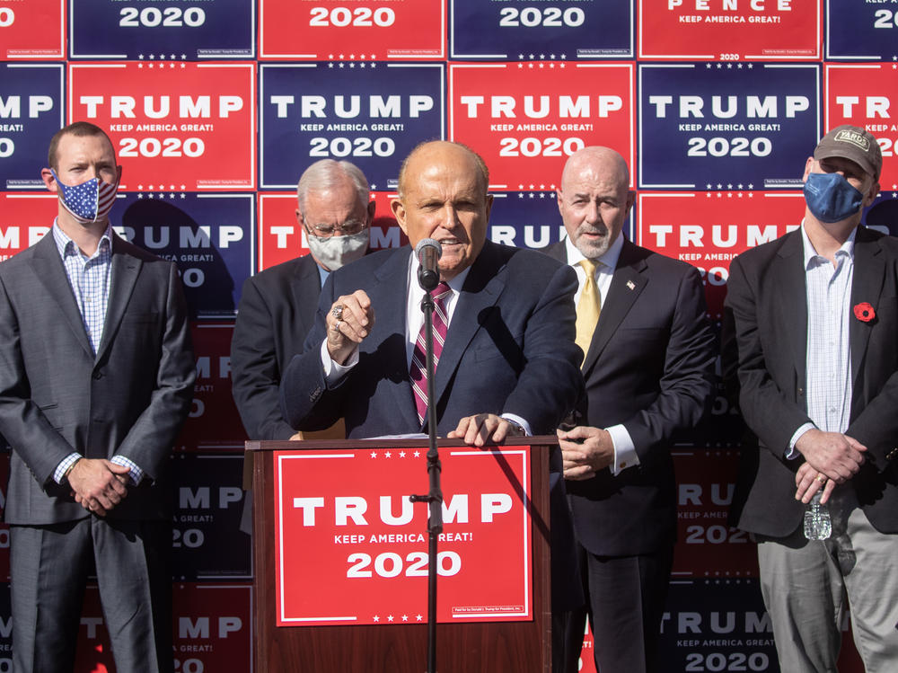 Attorney for the president Rudy Giuliani speaks to the media at a press conference held in the back parking lot of a landscaping company over the weekend in Philadelphia.