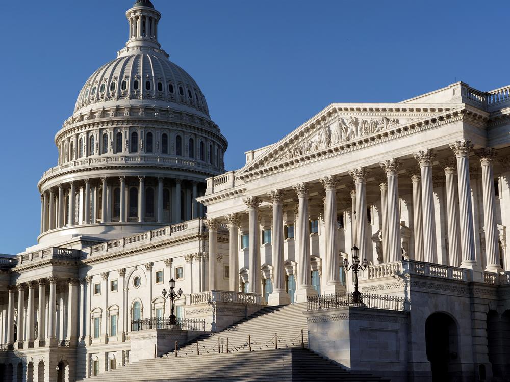 The Senate side of the Capitol is seen in Washington, D.C., early Monday. Experts say President-elect Joe Biden's ability to reshape the U.S. immigration system will be sharply limited if Republicans retain control of the Senate.