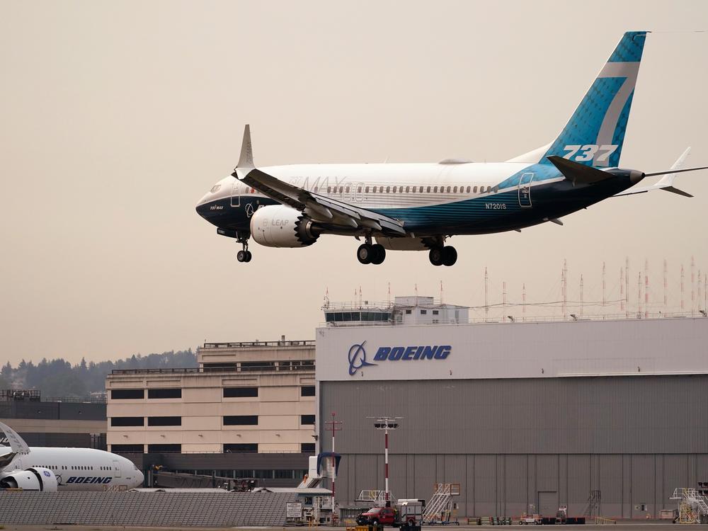 A Boeing 737 MAX jet, piloted by Federal Aviation Administration chief Stephen Dickson, prepares to land at Boeing Field following a test flight late September in Seattle.