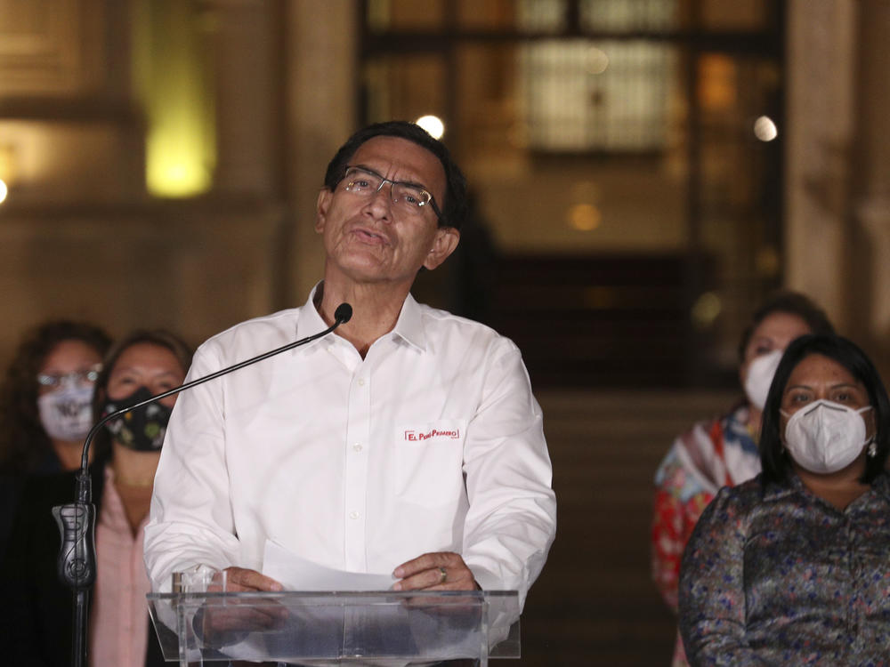 Peru's President Martín Vizcarra speaks in front of the presidential palace after lawmakers voted to remove him from office in Lima, Peru, on Monday. Peruvian lawmakers voted overwhelmingly to impeach Vizcarra, expressing anger over his handling of the coronavirus pandemic and citing unproven corruption allegations.