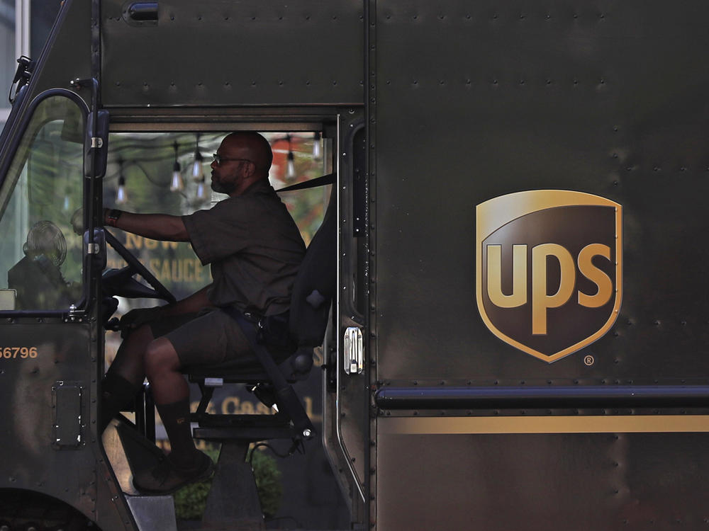 A UPS driver stops at a traffic light on April 24 in St. Louis. UPS employees are now allowed to grow their beards as the company loosens up on its appearance rules.