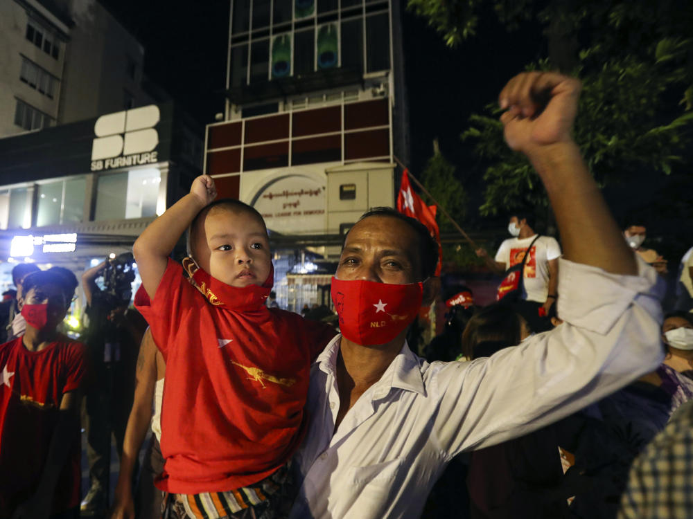 Supporters gather in front of Aung San Suu Kyi's National League for Democracy headquarters on Sunday, in Yangon, Myanmar.