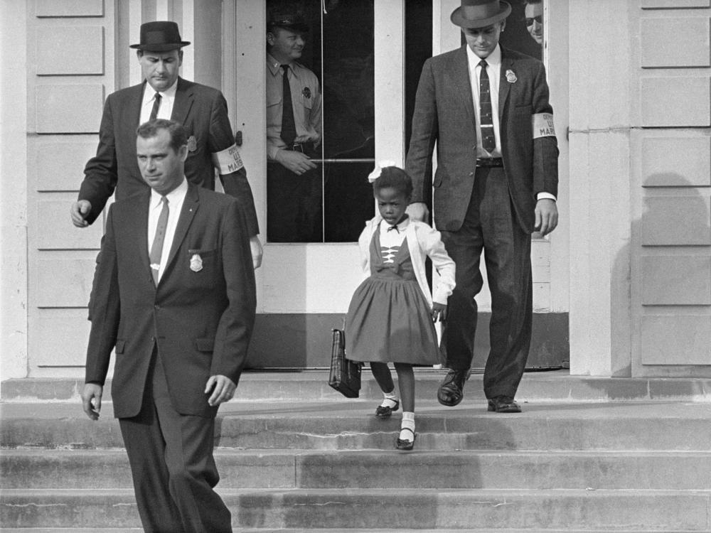 U.S. Deputy Marshals escort 6-year-old Ruby Bridges from William Frantz Elementary School in New Orleans, in this November 1960, file photo. Lucille Bridges, Ruby's mother, died Tuesday at the age of 86.