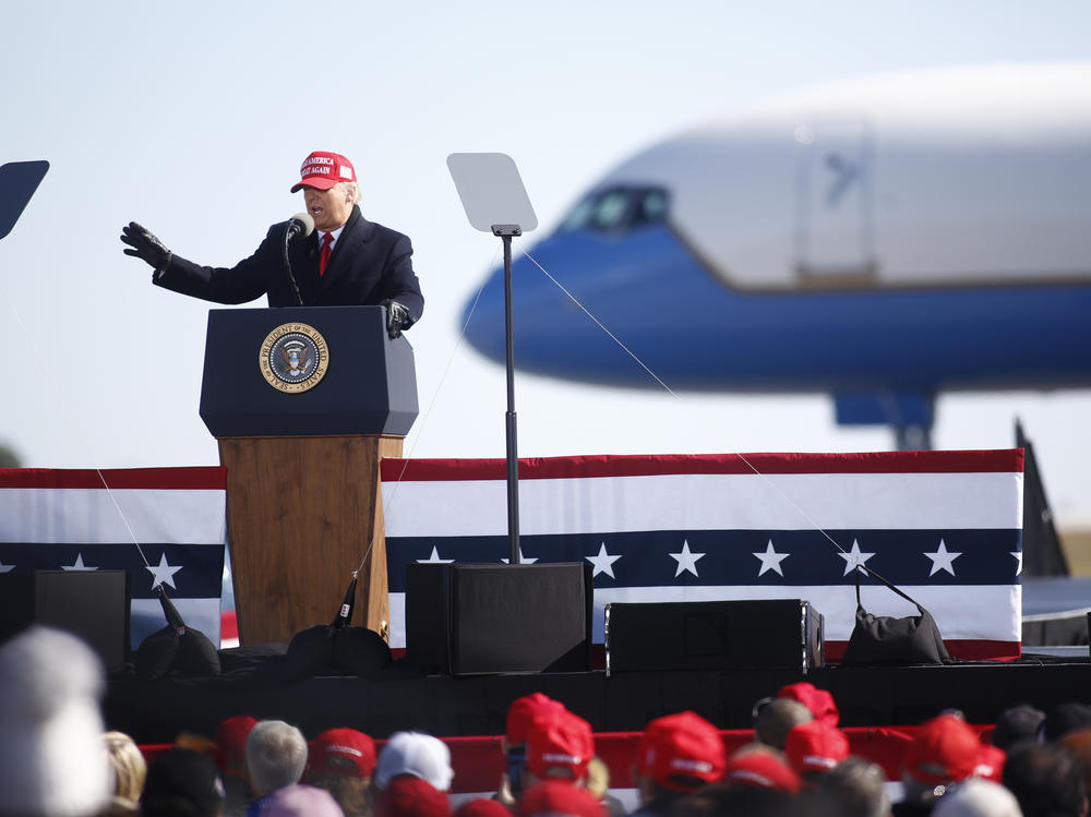 President Trump delivers remarks during a campaign rally at Fayetteville Regional Airport in North Carolina on the night before Election Day.