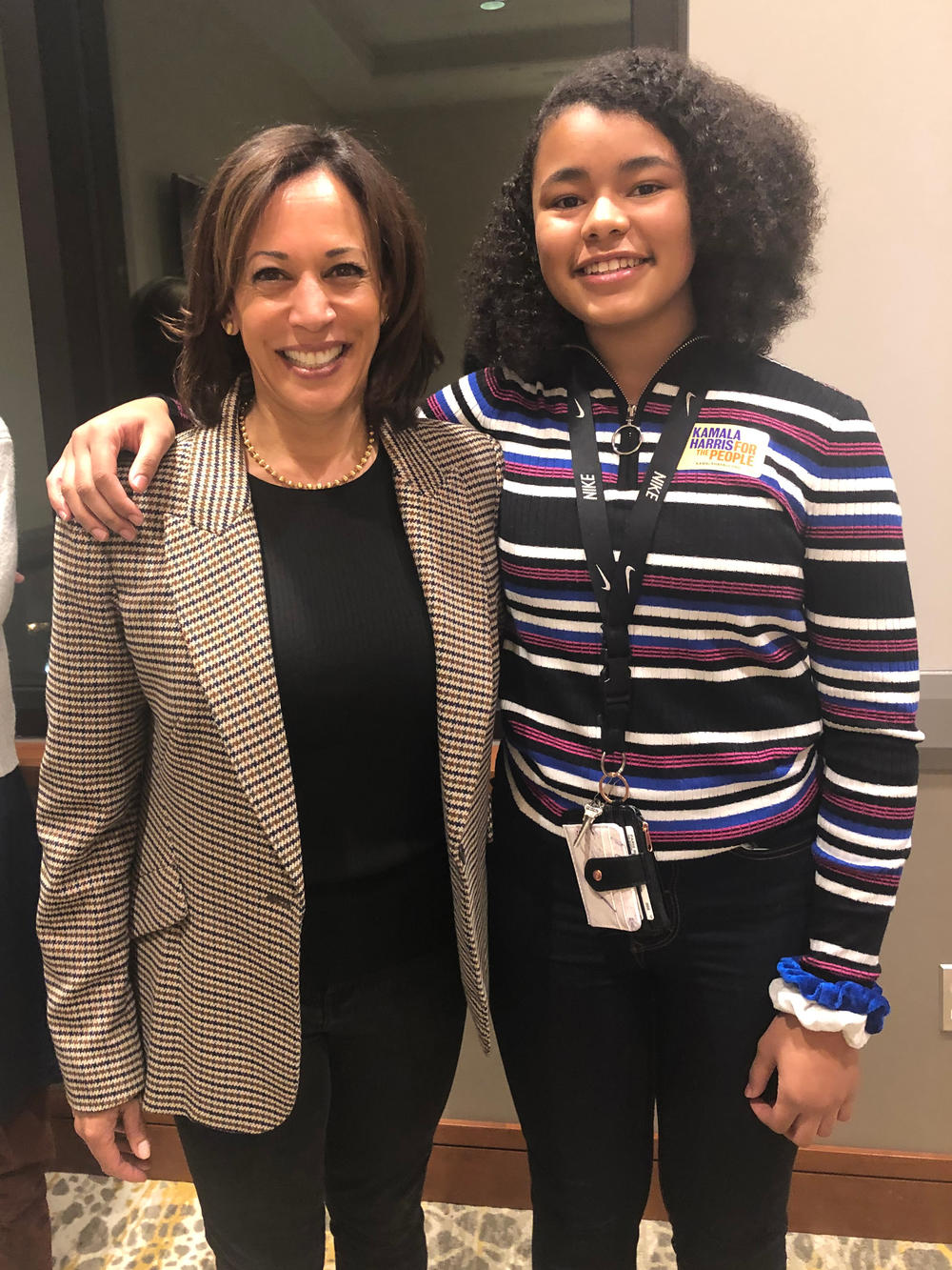 Harris poses with Paris Bond, then 13, at a meeting of supporters in Muscatine, Iowa, last year.